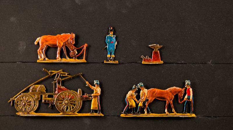 081  Glorious Empires, horseshoeing scene, simply painted.